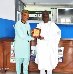 DG/CEO, Nigerian Technical Aid Corps (NTAC), Rt. Hon. Yusuf Buba Yakub, presenting a commemorative plaque to the Deputy Minister of Health of Sierra Leone, Prof. Charles Seusse, during a bilateral engagement visit in Freetown.