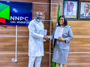 Managing Director, NNPC Gas Marketing Limited (NGML), Justin Ezeala and CEO of Ssonic Petroleum Ltd, Ifeoma Douglas, sign an 80mscf Gas Supply Agreement between the two companies for the proposed LNG Plant in Lekki Free Trade Zone, Lagos, on Thursday.